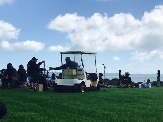 Heke-Nuku-Mai-Nga-Iwi Busby sitting next to his golf cart